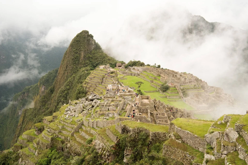 high-angle-beautiful-machu-picchu-citadel-surrounded-by-foggy-mountains-urubamba-peru-1